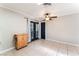 Dining area with tile floors, a ceiling fan, and access to the patio through glass doors at 5505 Reiter Ave, Las Vegas, NV 89108