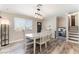 Spacious dining room featuring updated lighting and luxury vinyl plank flooring at 5505 Reiter Ave, Las Vegas, NV 89108