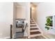 Hallway with a staircase leading upstairs and a view of the living room below at 5505 Reiter Ave, Las Vegas, NV 89108