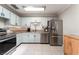 Kitchen with stainless steel appliances and neutral cabinets at 5505 Reiter Ave, Las Vegas, NV 89108