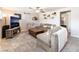 Inviting living room with comfortable seating, decorative shelves, and modern entertainment setup at 5505 Reiter Ave, Las Vegas, NV 89108