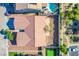 An aerial shot of the home highlighting the backyard pool, mini golf, landscaping, and privacy at 5653 Artesia Lake Ct, Las Vegas, NV 89118