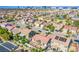 A community aerial shot with neighborhood homes, street access, backyard pools, and landscaping at 5653 Artesia Lake Ct, Las Vegas, NV 89118