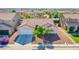 An aerial shot of the home, showing roof, desert landscaping, and surrounding neighborhood at 5653 Artesia Lake Ct, Las Vegas, NV 89118
