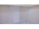 Walk-in closet with marble-look tile and shelf with hanging rack at 5653 Artesia Lake Ct, Las Vegas, NV 89118