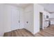 Bright entryway showcasing wood flooring, closet space, and modern access to the kitchen at 5653 Artesia Lake Ct, Las Vegas, NV 89118