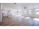 Spacious living room featuring modern decor, an open floor plan, and ample natural light at 5653 Artesia Lake Ct, Las Vegas, NV 89118