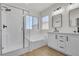 Bright bathroom featuring a separate shower, soaking tub, and double sink vanity at 715 Taliput Palm Pl, Henderson, NV 89011