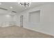 Bright, spacious bonus room with contemporary lighting, neutral walls, and carpet at 715 Taliput Palm Pl, Henderson, NV 89011