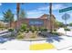 Community entrance to the Willows, featuring lush landscaping and a decorative wall at 715 Taliput Palm Pl, Henderson, NV 89011