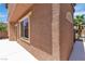 Close up of stucco wall and trim of home at 715 Taliput Palm Pl, Henderson, NV 89011