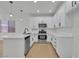 Contemporary kitchen with white cabinetry, modern appliances, and quartz countertops at 715 Taliput Palm Pl, Henderson, NV 89011