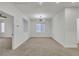 Spacious living room features neutral walls, carpet and ample light from window at 715 Taliput Palm Pl, Henderson, NV 89011