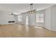 Bright living room with fireplace, ceiling fan, light wood flooring and recessed lighting at 715 Taliput Palm Pl, Henderson, NV 89011