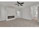 Spacious main bedroom boasts a modern fireplace and plush carpeting at 715 Taliput Palm Pl, Henderson, NV 89011