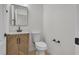 Stylish powder room featuring a modern vanity with elegant fixtures at 715 Taliput Palm Pl, Henderson, NV 89011