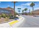 Street view of The Willows community entrance with lush landscaping and palm trees at 715 Taliput Palm Pl, Henderson, NV 89011