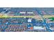 Wide aerial view of a commercial district surrounded by neighborhoods in Las Vegas, Nevada at 7221 W Washington Ave, Las Vegas, NV 89128