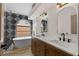 Bathroom with soaking tub, double sink vanity, and decorative backsplash at 7221 W Washington Ave, Las Vegas, NV 89128