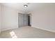 Well lit bedroom with carpet and closet with sliding doors, creating a functional and inviting space at 7221 W Washington Ave, Las Vegas, NV 89128
