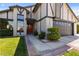 Beautiful home featuring a well-manicured lawn, a brick-lined walkway, and an attached two-car garage at 7221 W Washington Ave, Las Vegas, NV 89128