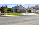 Charming two-story home with well-maintained front yard and attached two-car garage at 7221 W Washington Ave, Las Vegas, NV 89128