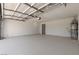 Spacious two car garage with sealed floor, equipped with a water heater, and overhead lighting at 7221 W Washington Ave, Las Vegas, NV 89128