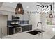 Beautiful kitchen featuring stainless steel appliances, modern countertops, and stylish light fixtures at 7221 W Washington Ave, Las Vegas, NV 89128