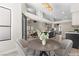 Open floor plan showcases a modern kitchen flowing into the dining and living areas, great for entertaining at 7221 W Washington Ave, Las Vegas, NV 89128