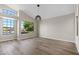 Bright and airy living room with large windows and wood-style flooring at 7221 W Washington Ave, Las Vegas, NV 89128