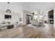 Spacious living room with fireplace, wood floors, and ample seating, perfect for relaxation and entertaining at 7221 W Washington Ave, Las Vegas, NV 89128