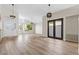 Open living room with wood-style floors, high ceilings, and lots of natural light at 7221 W Washington Ave, Las Vegas, NV 89128