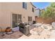 Backyard featuring a patio area and a well-maintained lawn at 728 Twilight Blue Ave, North Las Vegas, NV 89032
