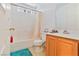 Bright bathroom featuring a bathtub, shower, single sink vanity, and medicine cabinet at 728 Twilight Blue Ave, North Las Vegas, NV 89032