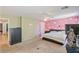 Bright bedroom with a unique accent wall, ceiling fan, and ample closet space at 728 Twilight Blue Ave, North Las Vegas, NV 89032
