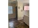 Neutral-toned living room with a tiled floor, window and doorway access at 728 Twilight Blue Ave, North Las Vegas, NV 89032