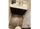 Efficient powder room showing a dark vanity cabinet and a white vessel sink at 728 Twilight Blue Ave, North Las Vegas, NV 89032