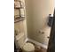 Cozy toilet with a neutral palette and shelf, maximizing space and organization at 728 Twilight Blue Ave, North Las Vegas, NV 89032