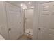 All-white bathroom features a glass-enclosed shower at 7332 N Decatur Blvd # 2, North Las Vegas, NV 89084