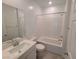 Bright bathroom with a combination tub and shower at 7332 N Decatur Blvd # 2, North Las Vegas, NV 89084