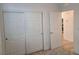 Bright bedroom features neutral carpet, closet with sliding doors and white trim throughout at 7332 N Decatur Blvd # 2, North Las Vegas, NV 89084