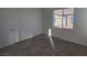 Carpeted bedroom provides natural light from one window at 7332 N Decatur Blvd # 2, North Las Vegas, NV 89084