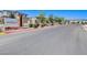 Community entrance featuring Roxbury signage, landscaping, and street view at 7332 N Decatur Blvd # 2, North Las Vegas, NV 89084