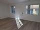 Bright living room featuring light wood floors, modern windows, and a clean, minimalist design at 7332 N Decatur Blvd # 2, North Las Vegas, NV 89084
