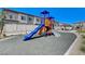 Community playground with slides and equipment for outdoor fun and recreation under a clear blue sky at 7332 N Decatur Blvd # 2, North Las Vegas, NV 89084