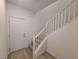 Clean staircase features hardwood flooring on the bottom level and carpet on the stairs at 7332 N Decatur Blvd # 2, North Las Vegas, NV 89084