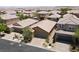 Neighborhood aerial view showcasing homes with well-maintained landscaping and desert backdrop at 759 Star Apple Ln, Las Vegas, NV 89178
