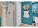 Up close view of a newly renovated bathroom and shower with nautical decorations at 759 Star Apple Ln, Las Vegas, NV 89178