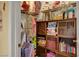 Organized closet space featuring shelves filled with clothes, books, and accessories at 759 Star Apple Ln, Las Vegas, NV 89178