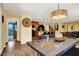Open-concept dining room featuring stylish lighting and seamless flow to the kitchen and living areas at 759 Star Apple Ln, Las Vegas, NV 89178